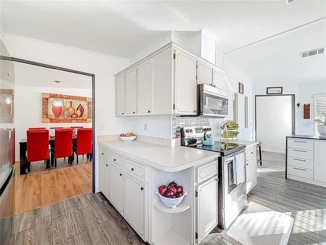 a bedroom with a bed and a mirror