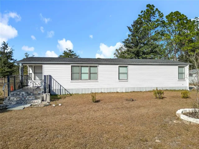 a view of a swimming pool with an outdoor seating