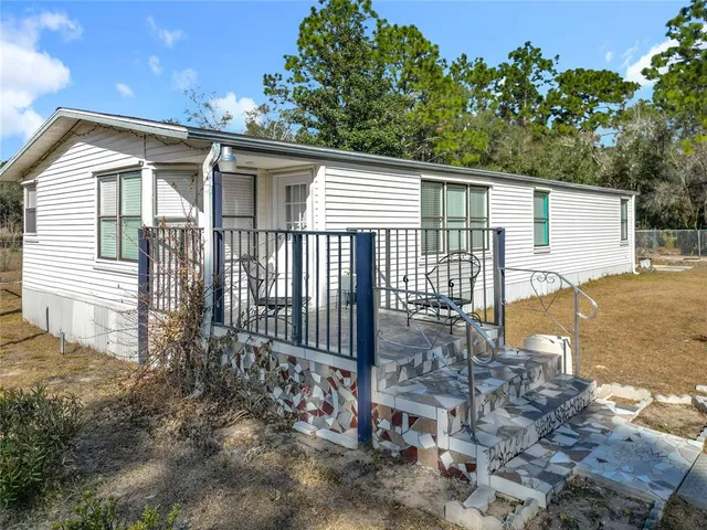 a view of a house with a potted plant