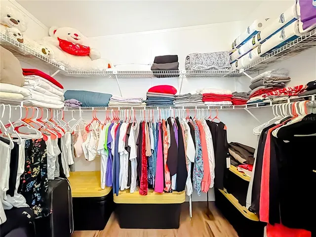 a bathroom with a granite countertop sink mirror and toilet