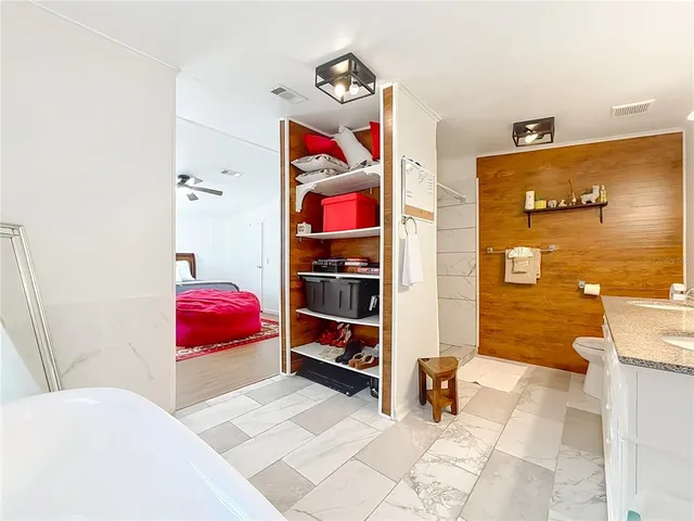 a dining room with furniture and wooden floor