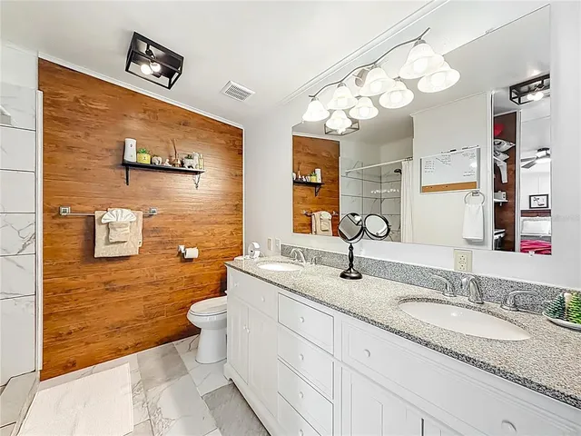 a balcony with furniture and wooden floor