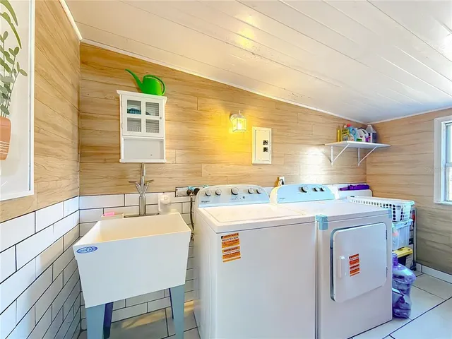 swimming pool view with a seating space