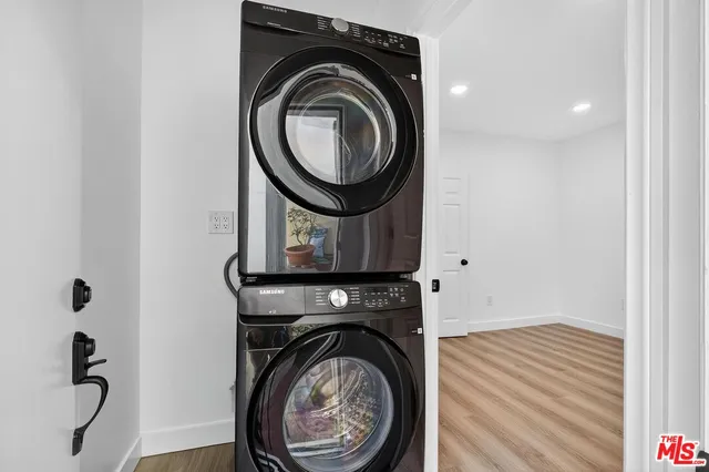 a view of storage and utility room with washer and dryer