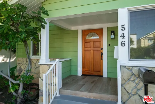 a front view of a house with a porch
