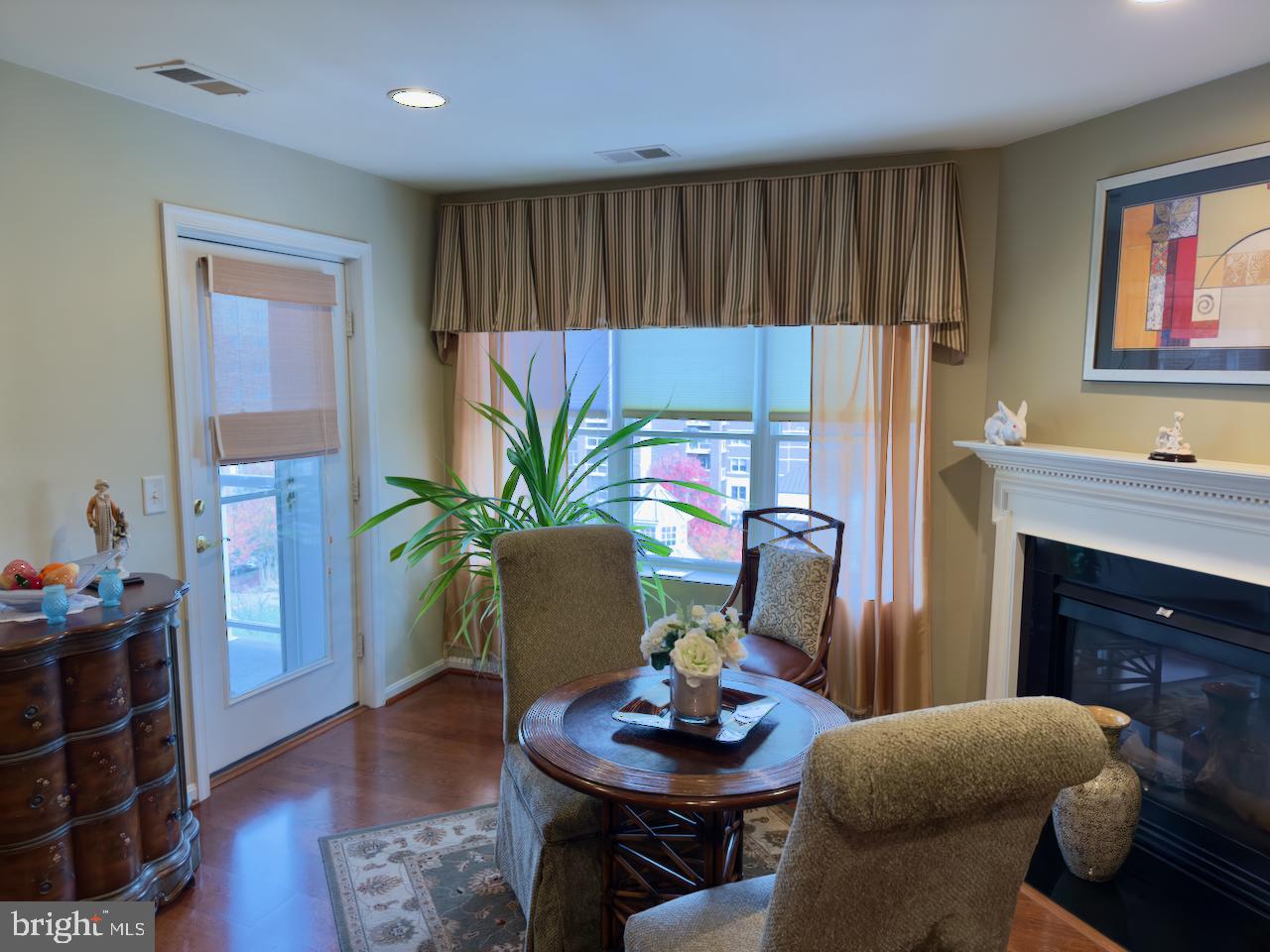12251 Roundwood Road, Unit 601 Lutherville-Timonium, MD 21093 - Photo 19 of 41 Family room/ dining area with gas fireplace