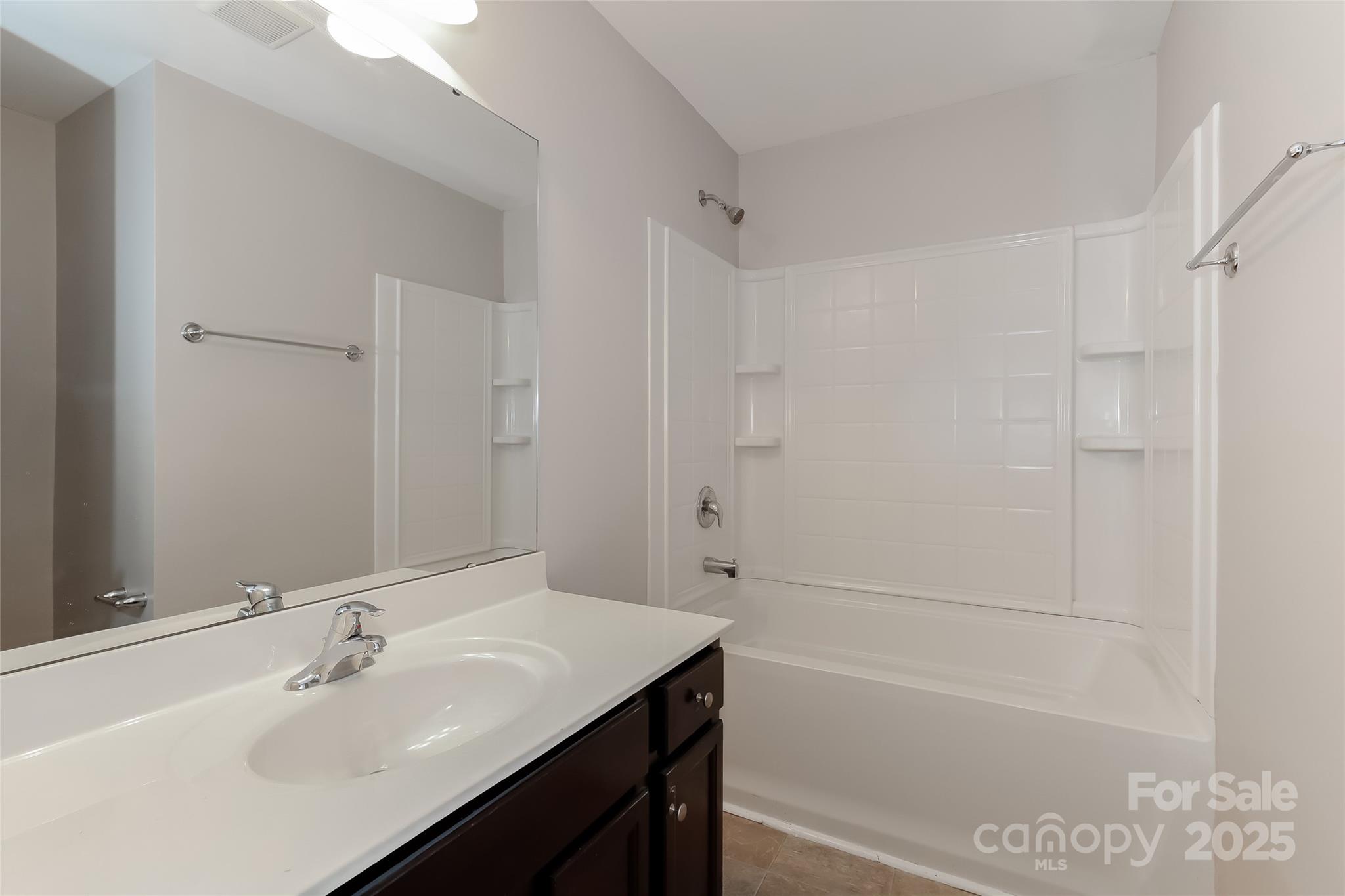 437 Danielle Way Fort Mill, SC 29715 - Photo 11 of 15 a bathroom with a bathtub sink vanity and a shower