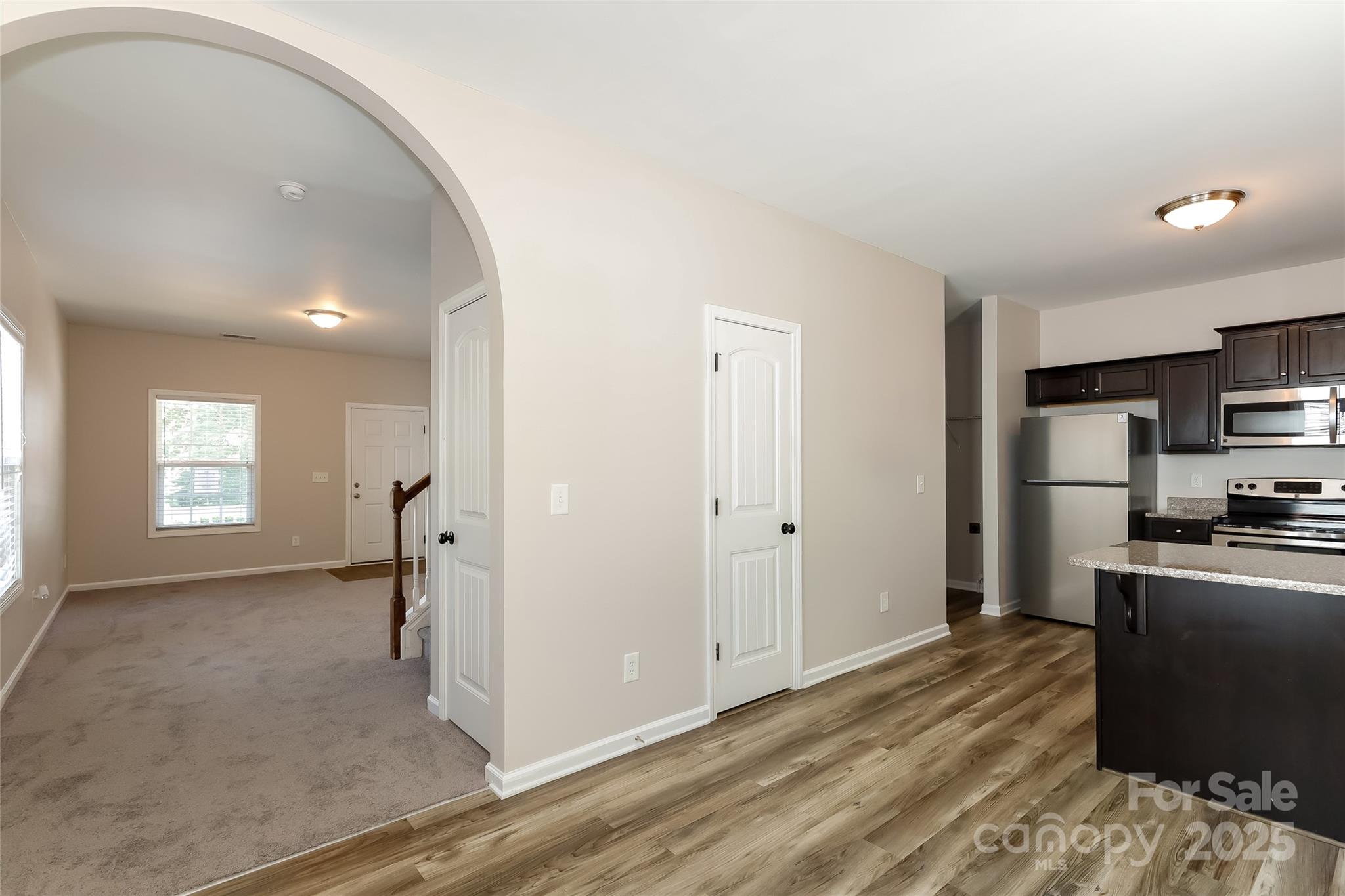 437 Danielle Way Fort Mill, SC 29715 - Photo 6 of 15 a view of a kitchen with a sink refrigerator and wooden floor