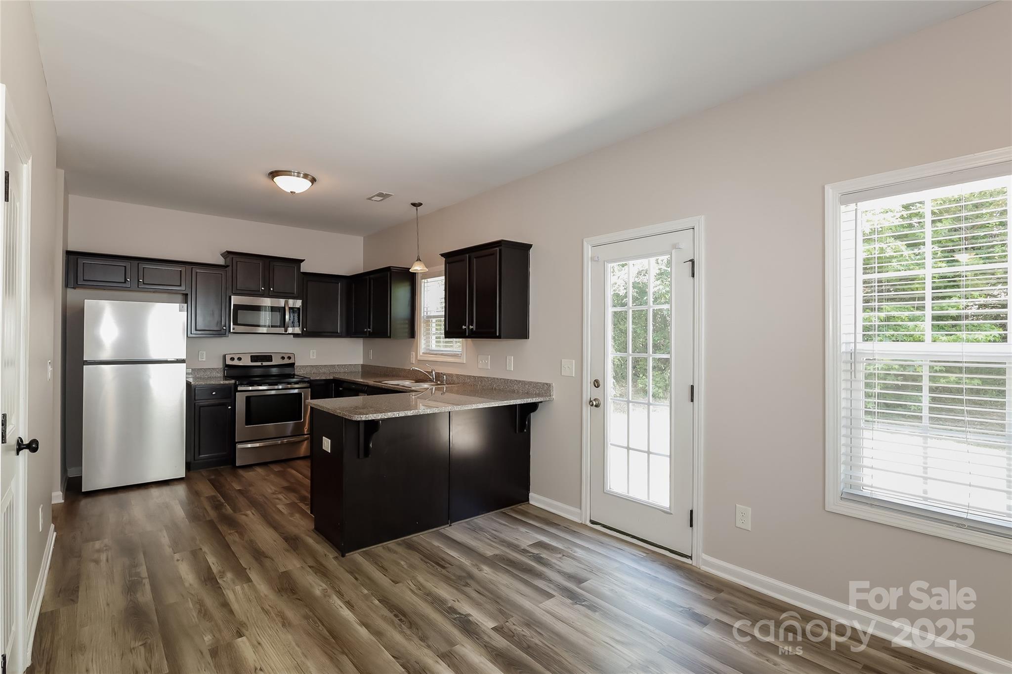 437 Danielle Way Fort Mill, SC 29715 - Photo 8 of 15 a kitchen with stainless steel appliances granite countertop a stove and a refrigerator