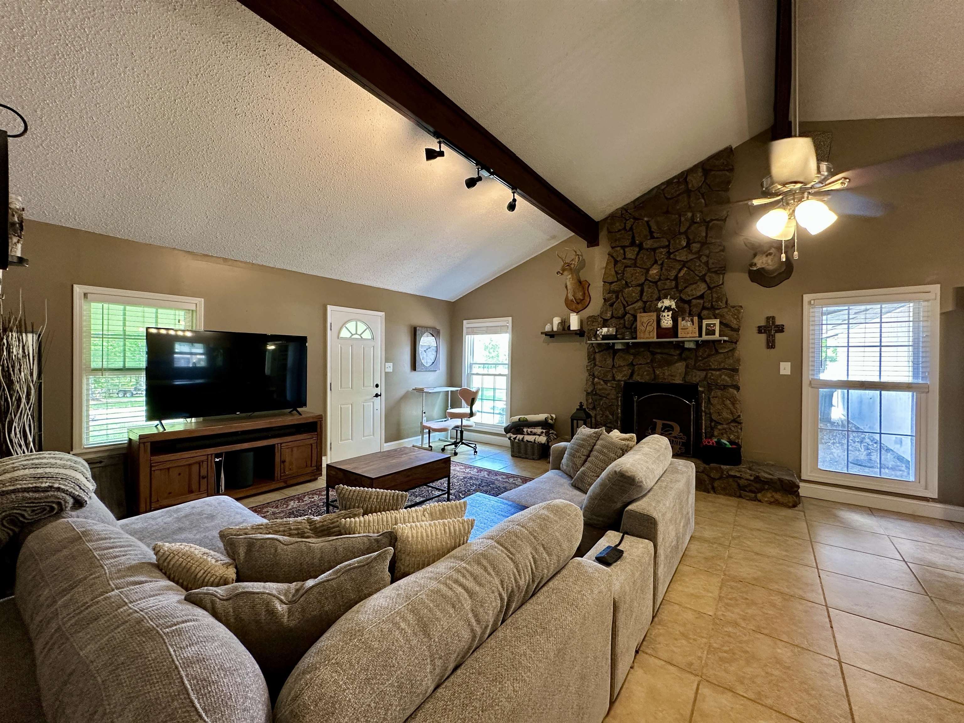 1230 Joann Road Somerville, TN 38068 - Photo 6 of 29 Vaulted ceiling living space featuring exposed wood beams and track lighting