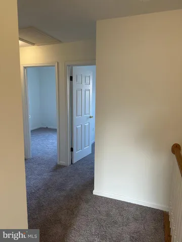 a front view of a house with large windows