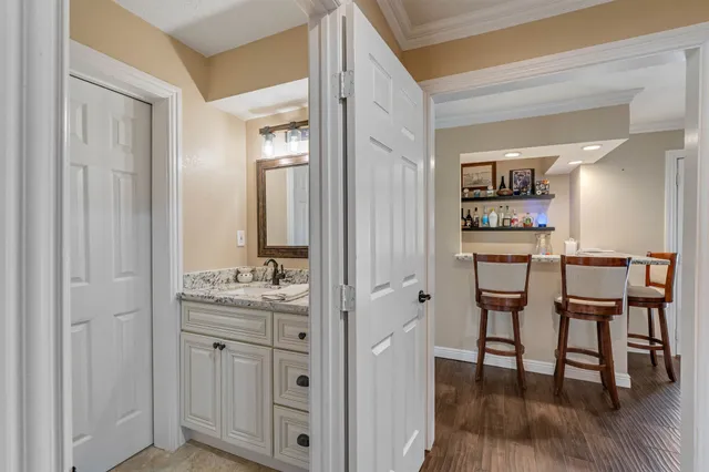 a bathroom with a sink and a mirror