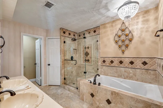 a bathroom with a bathtub and shower