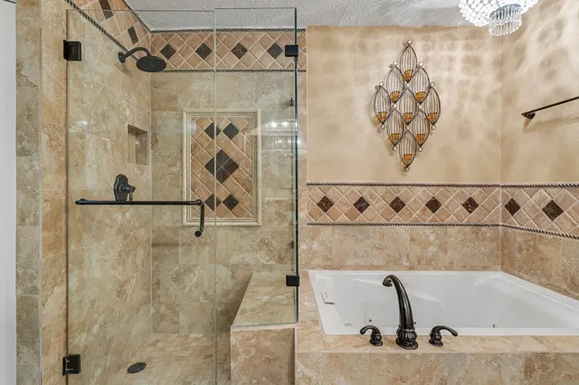 a bathroom with a bathtub and shower