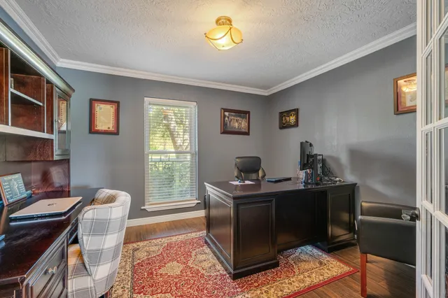 a workspace with furniture and window