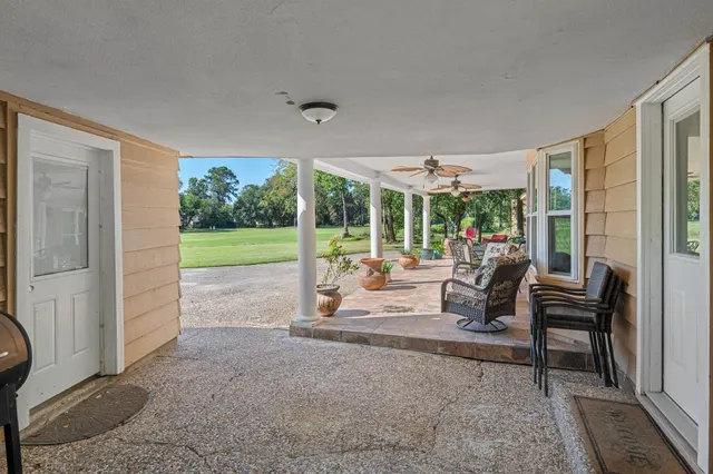 a view of a livingroom with furniture and garden