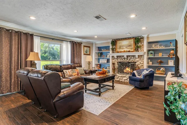a living room with furniture and a fireplace