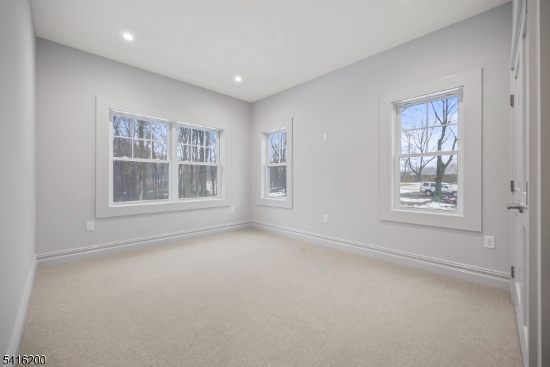 1209 Littleton Road, Unit D Morris Plains, NJ 07950 - Photo 12 of 23 a view of an empty room with a window
