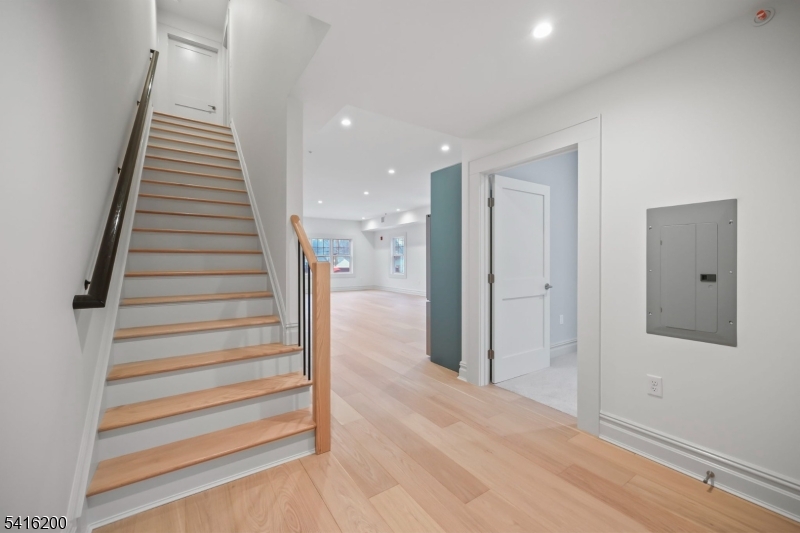 1209 Littleton Road, Unit D Morris Plains, NJ 07950 - Photo 15 of 23 a view of a hallway with wooden floor and entryway