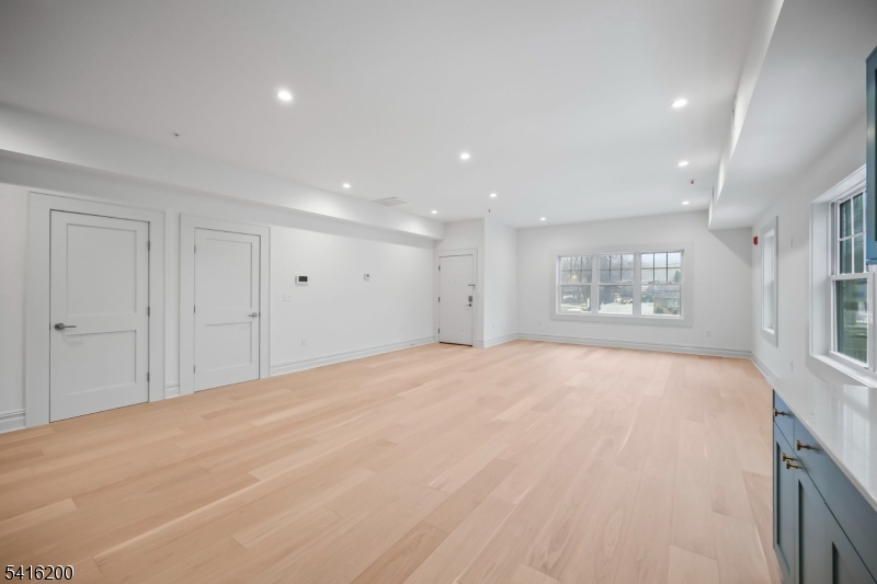 1209 Littleton Road, Unit D Morris Plains, NJ 07950 - Photo 3 of 23 a view of an empty room with a window