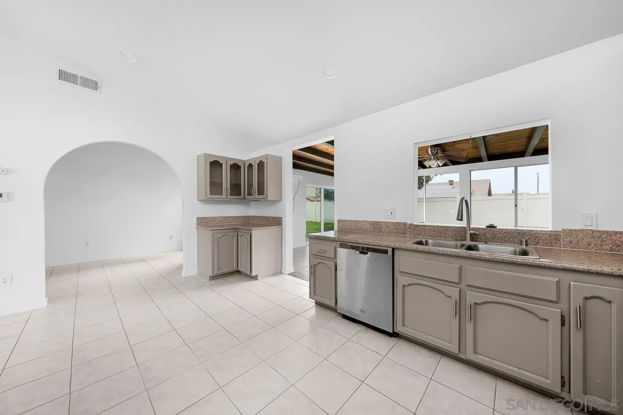 9927 Sadie Street Santee, CA 92071 - Photo 11 of 29 a spacious bathroom with a double vanity sink a mirror and a bathtub