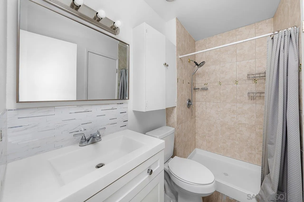 9927 Sadie Street Santee, CA 92071 - Photo 18 of 29 a bathroom with a sink a toilet and shower