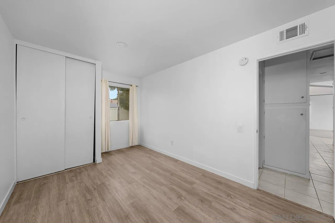 9927 Sadie Street Santee, CA 92071 - Photo 20 of 29 a view of an empty room with wooden floor and closet