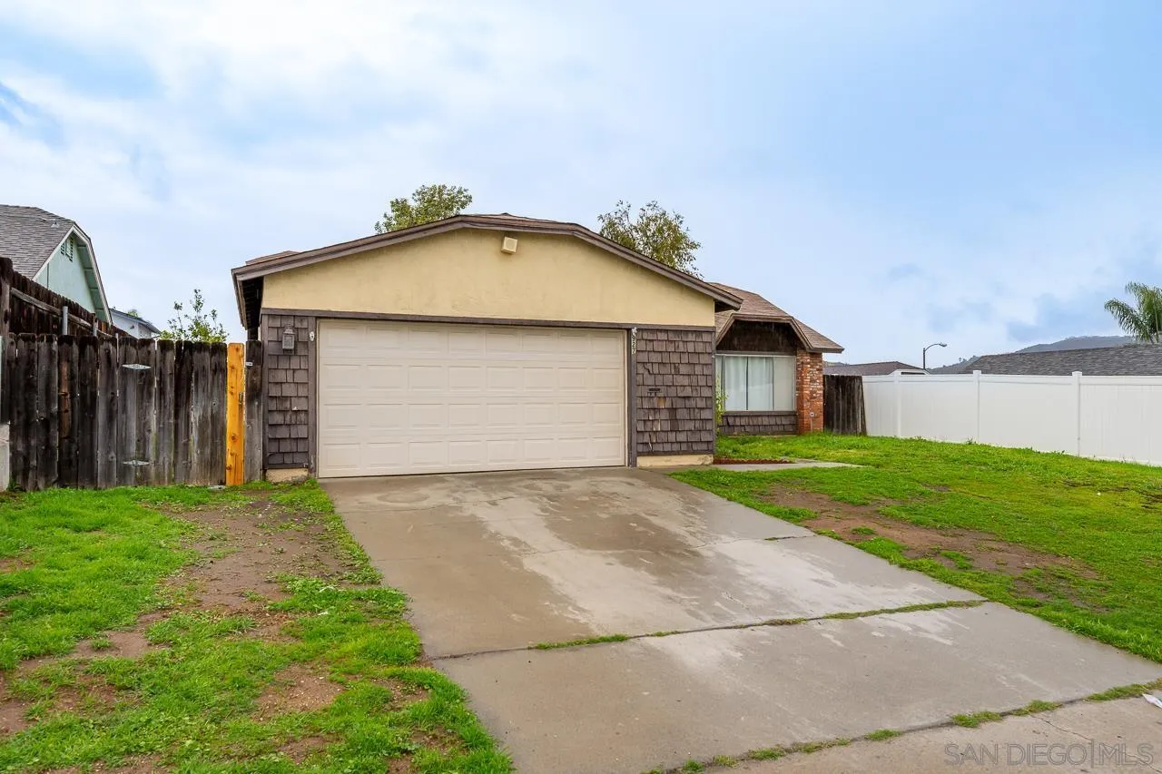 9927 Sadie Street Santee, CA 92071 - Photo 2 of 29 a view of backyard of house with garage