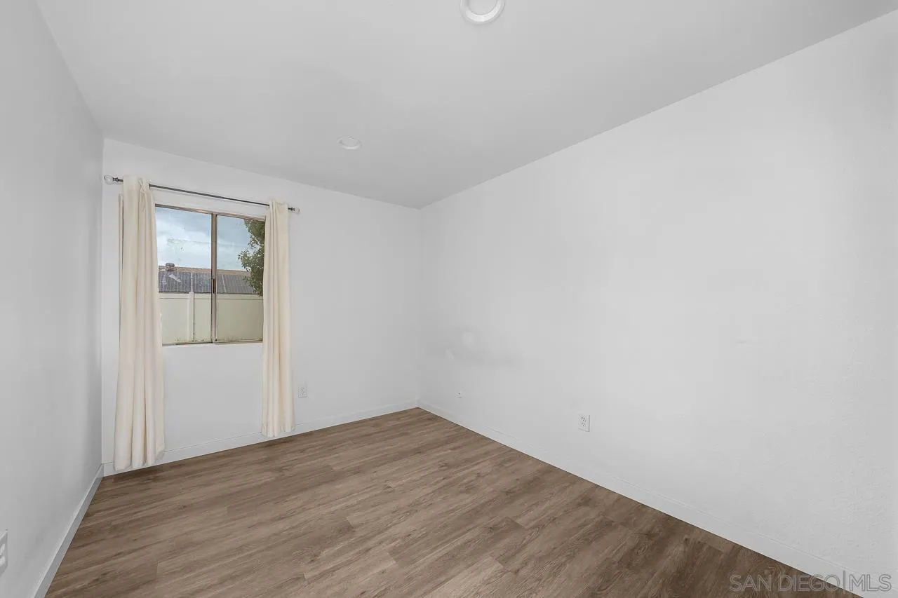 9927 Sadie Street Santee, CA 92071 - Photo 21 of 29 a view of an empty room with wooden floor and closet