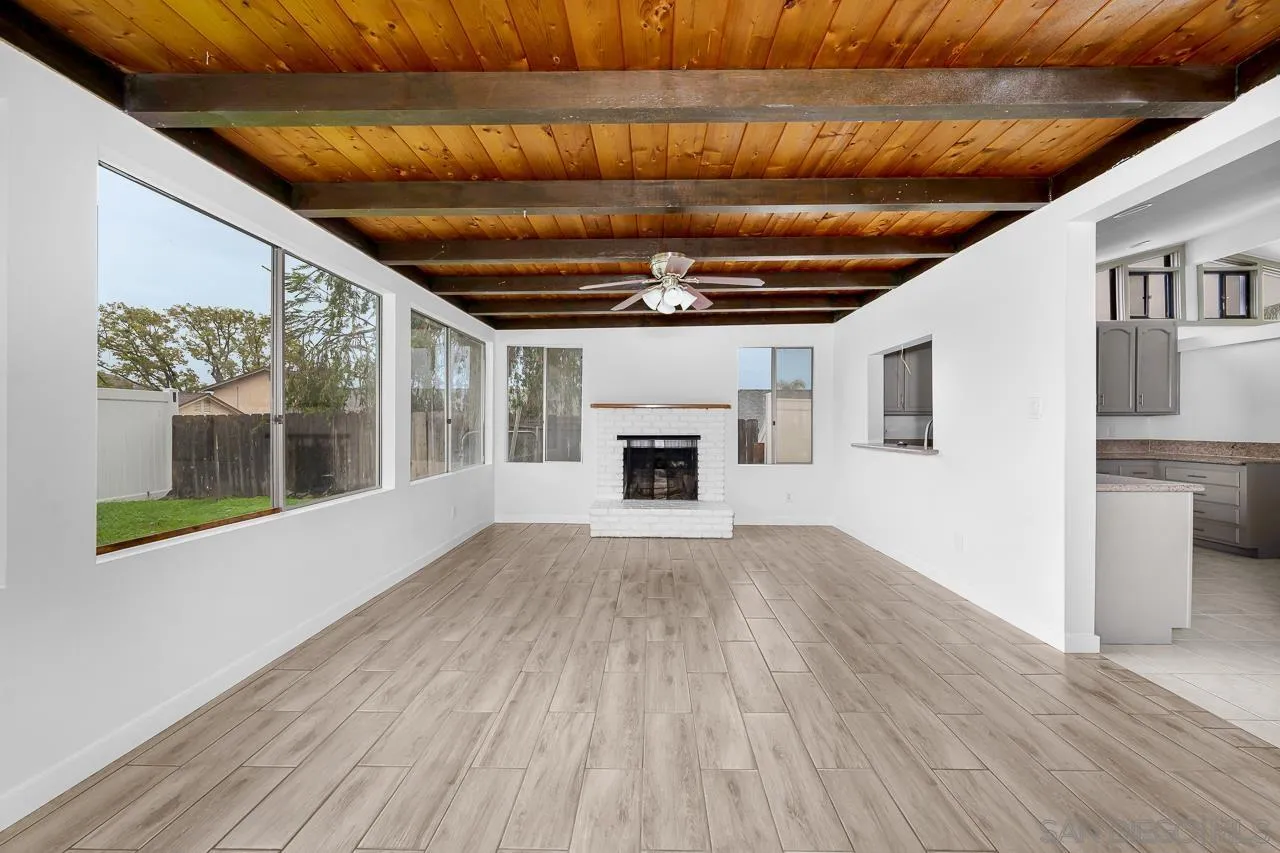 9927 Sadie Street Santee, CA 92071 - Photo 25 of 29 a view of empty room with wooden floor and fireplace
