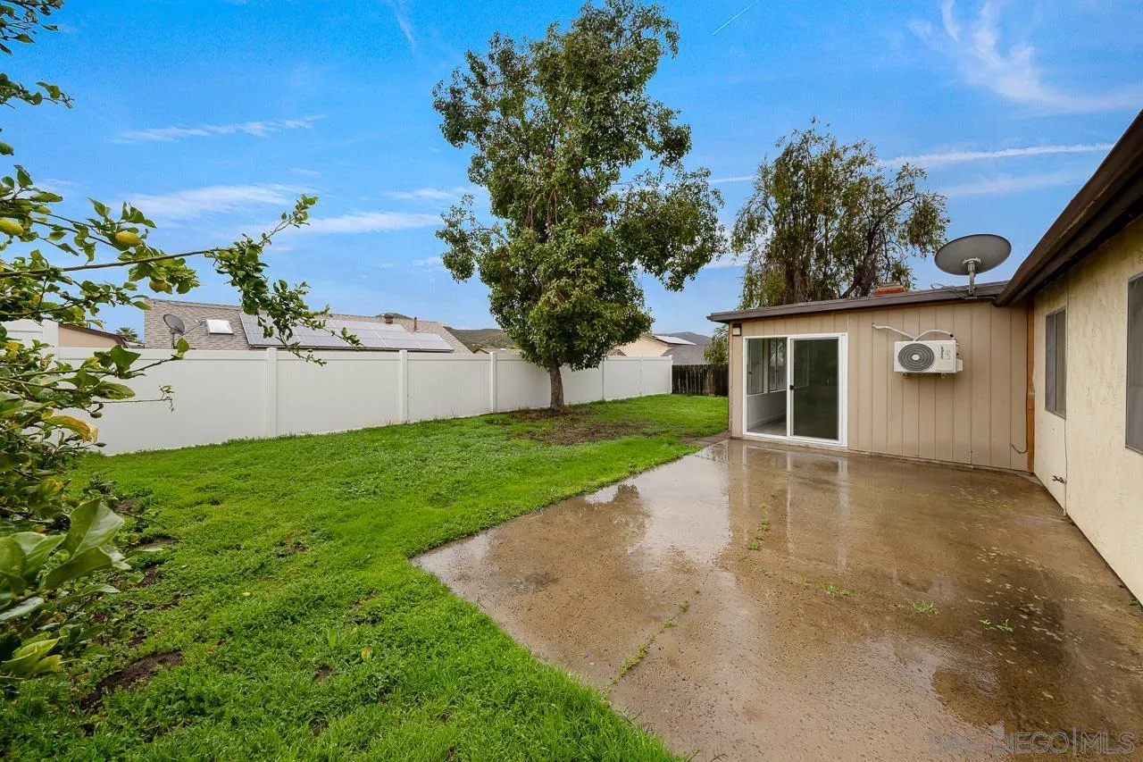 9927 Sadie Street Santee, CA 92071 - Photo 26 of 29 a view of a house with a backyard
