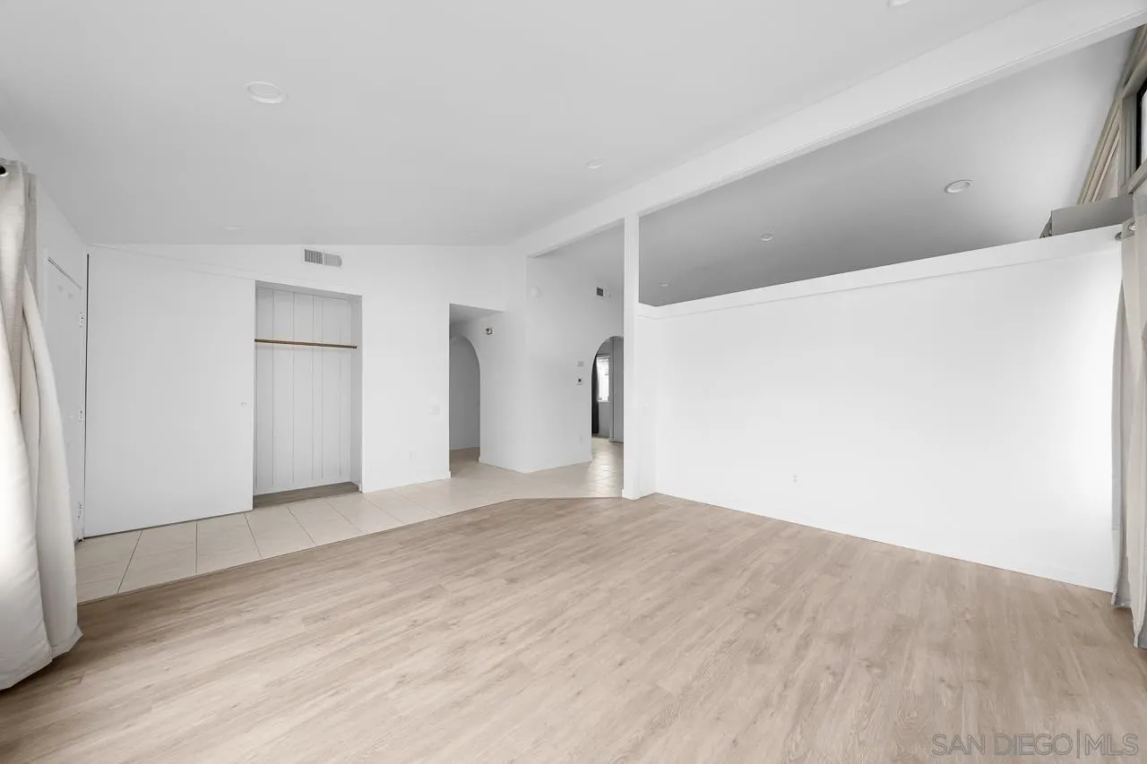 9927 Sadie Street Santee, CA 92071 - Photo 5 of 29 a view of an empty room with wooden floor