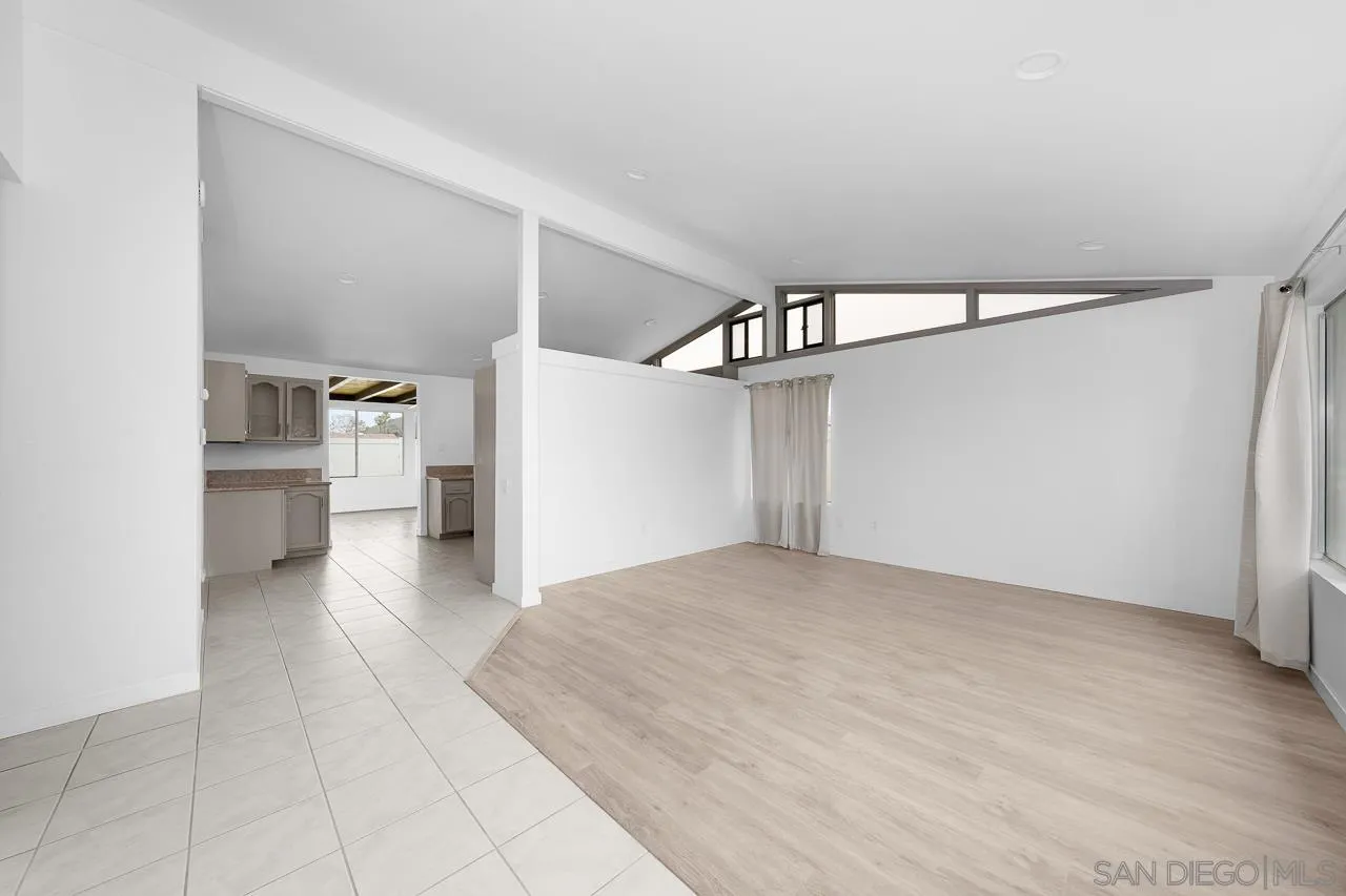 9927 Sadie Street Santee, CA 92071 - Photo 7 of 29 a view of a hallway view with wooden floor and staircase