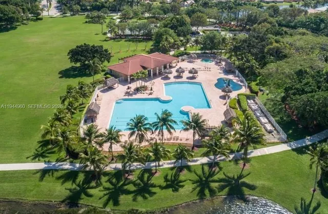 an aerial view of a house with a garden