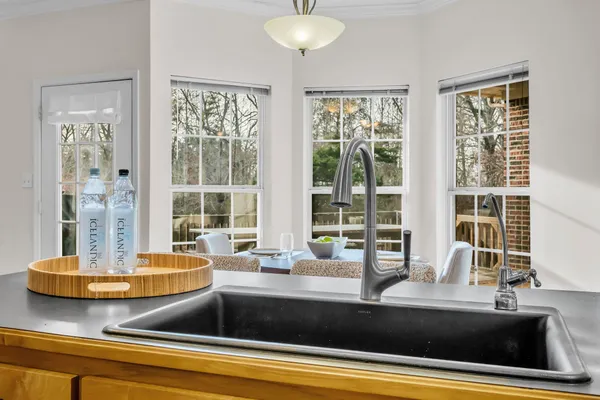 a view of a counter top with granite countertop and couches