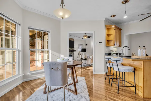 a living room with kitchen island furniture and a large window