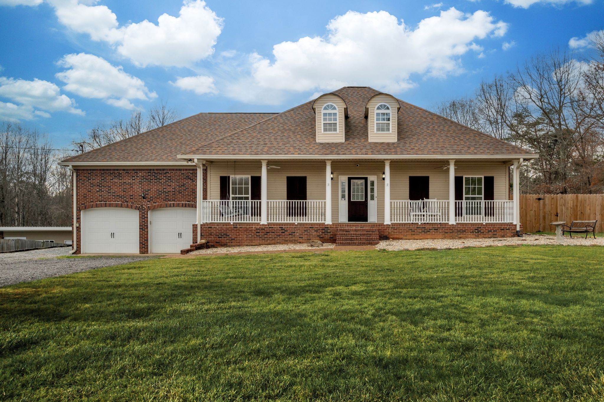 1958 Spencer Mill Road Burns, TN 37029 - Photo 2 of 38 a front view of a house with a garden