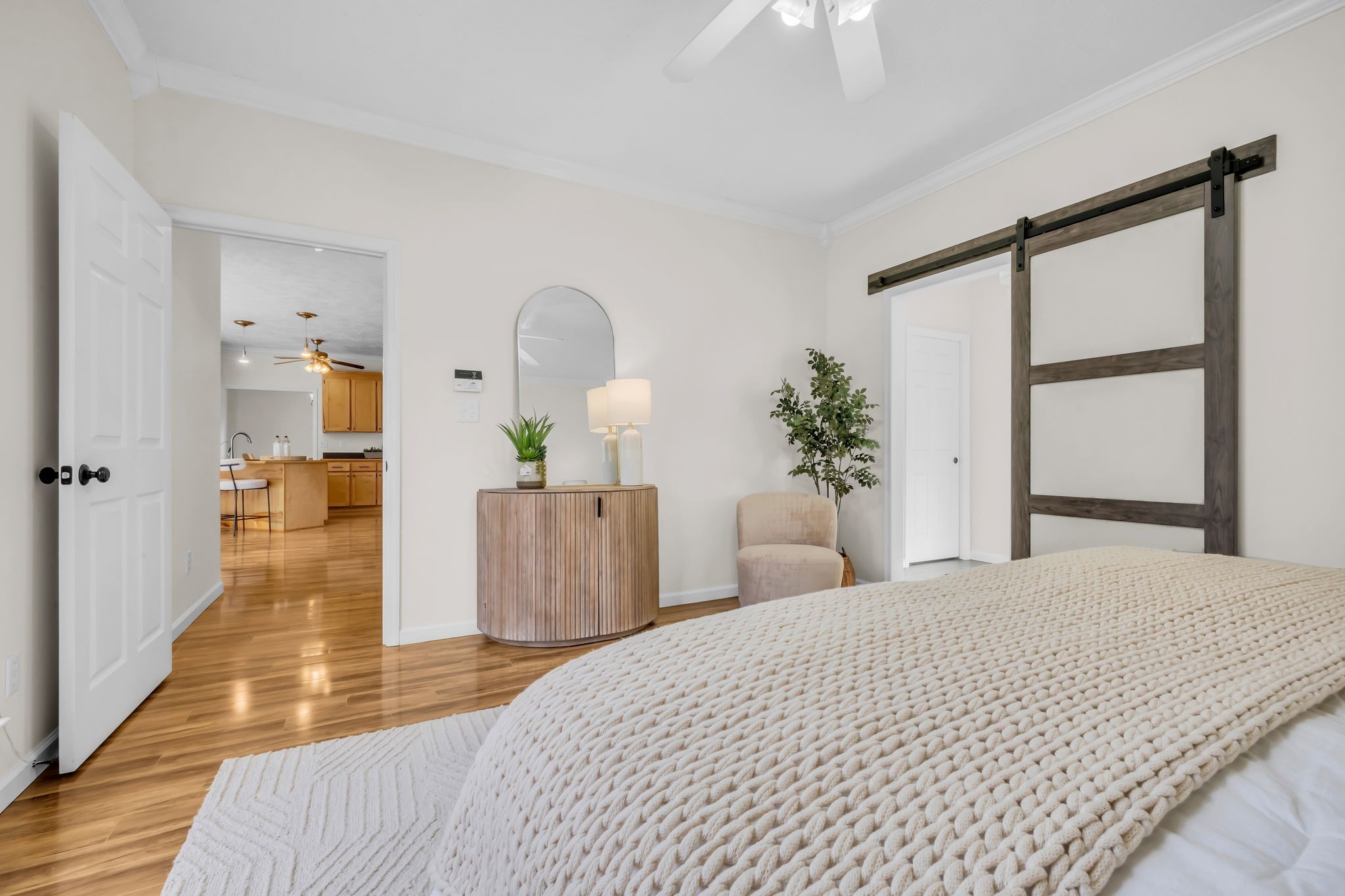 1958 Spencer Mill Road Burns, TN 37029 - Photo 22 of 38 a bedroom with a large bed and a chandelier