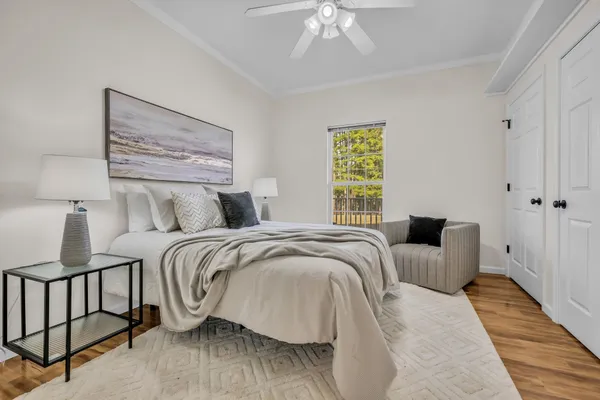 a bedroom with bed and a window