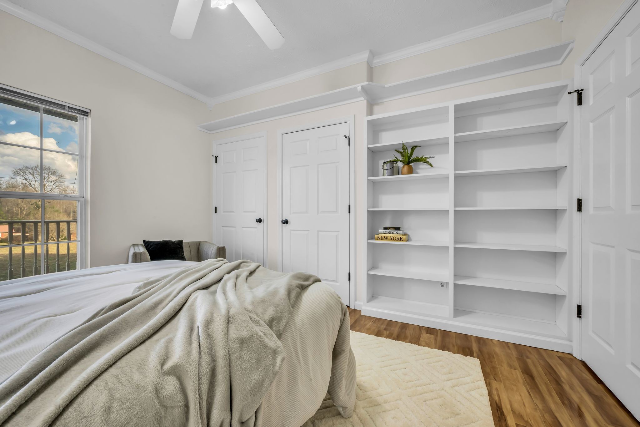 1958 Spencer Mill Road Burns, TN 37029 - Photo 30 of 38 a bed sitting in a bedroom next to a window