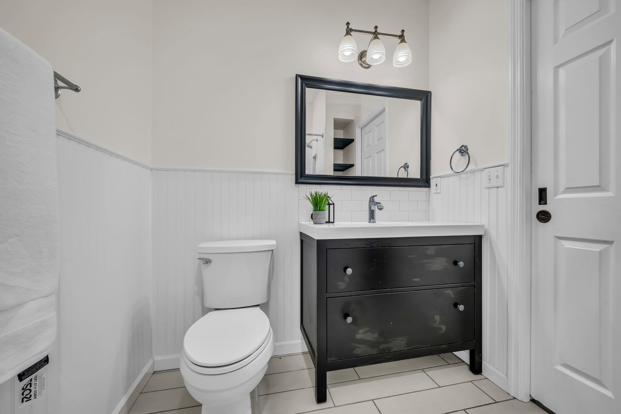 1958 Spencer Mill Road Burns, TN 37029 - Photo 32 of 38 a bathroom with a toilet sink and mirror