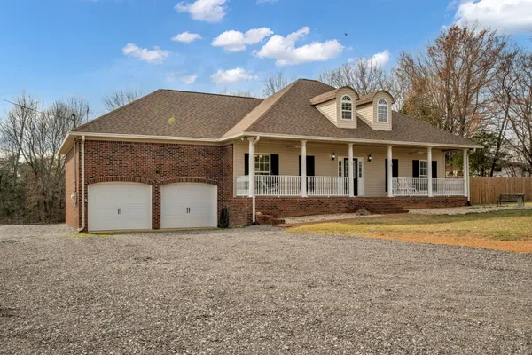 a view of a large building with a bench