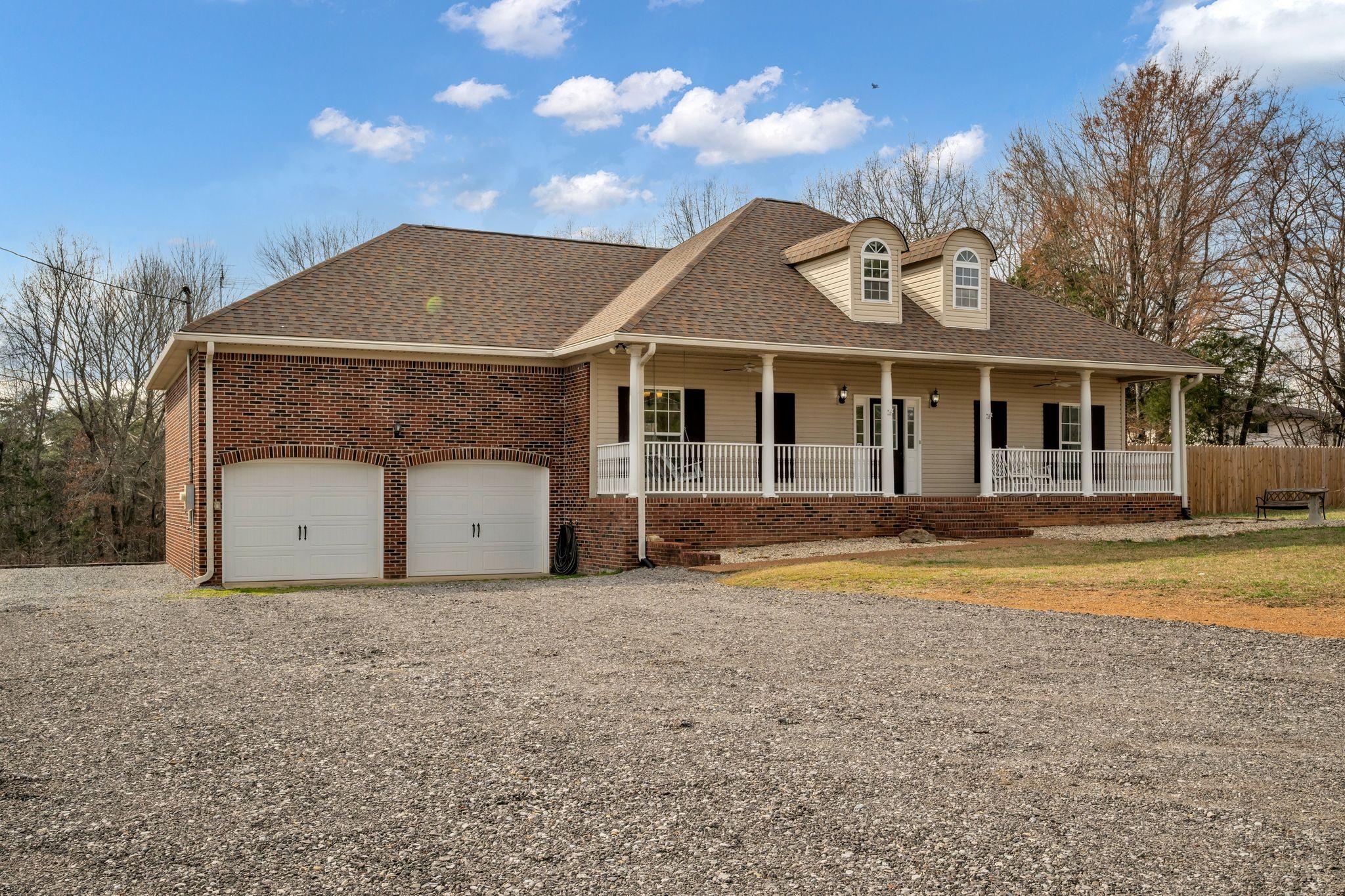 1958 Spencer Mill Road Burns, TN 37029 - Photo 34 of 38 a front view of a house with a garden and yard
