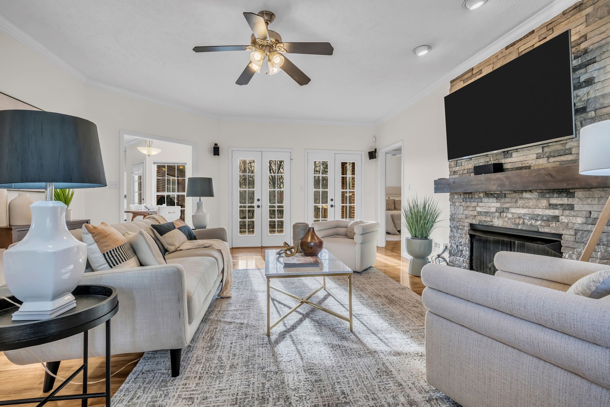 1958 Spencer Mill Road Burns, TN 37029 - Photo 4 of 38 a living room with furniture a flat screen tv and a fireplace