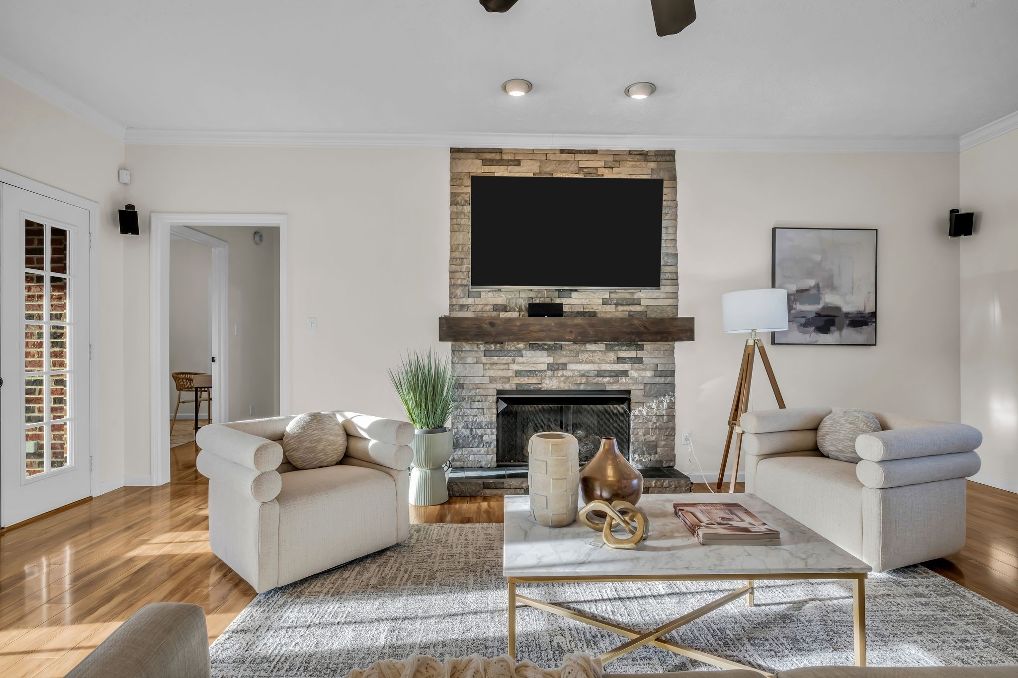 1958 Spencer Mill Road Burns, TN 37029 - Photo 6 of 38 a living room with furniture a flat screen tv and a fireplace