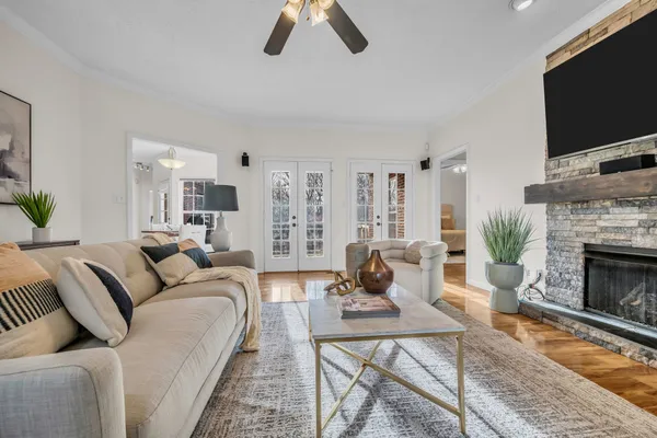 a living room with furniture fireplace and flat screen tv