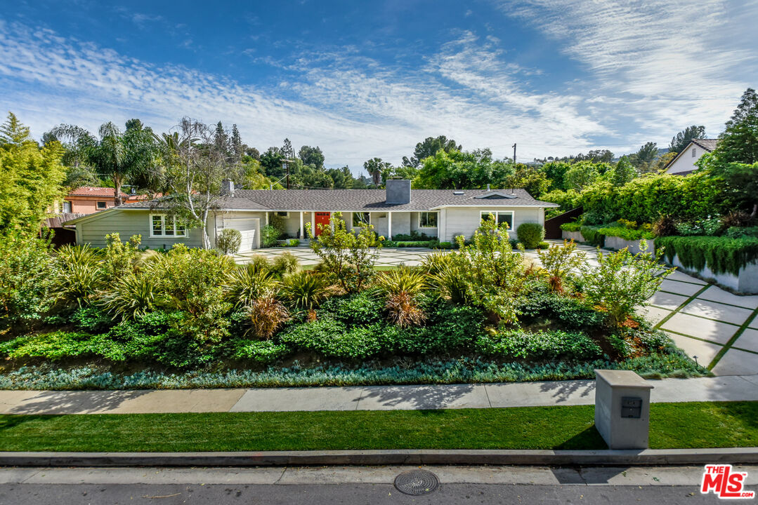 16722 Adlon Road Encino, CA 91436 - Photo 1 of 36 a front view of a house with a yard