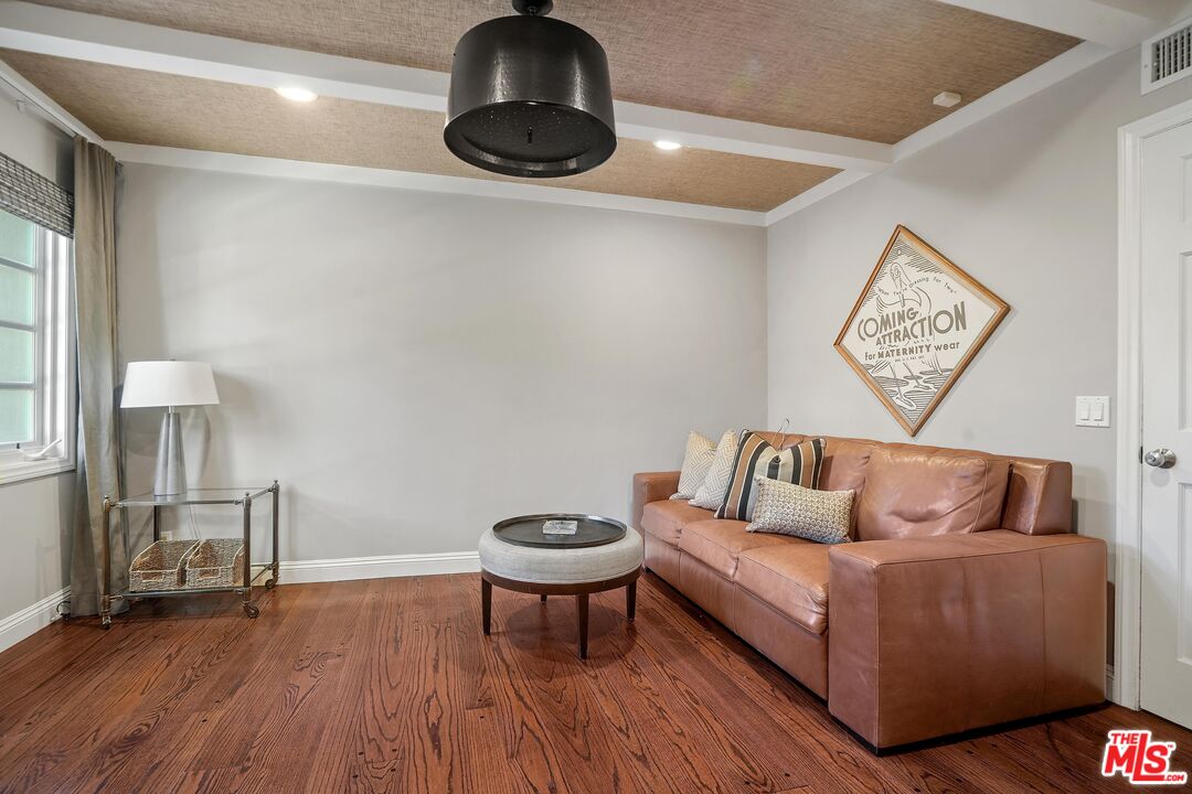 16722 Adlon Road Encino, CA 91436 - Photo 22 of 36 a living room with furniture and a wooden floor