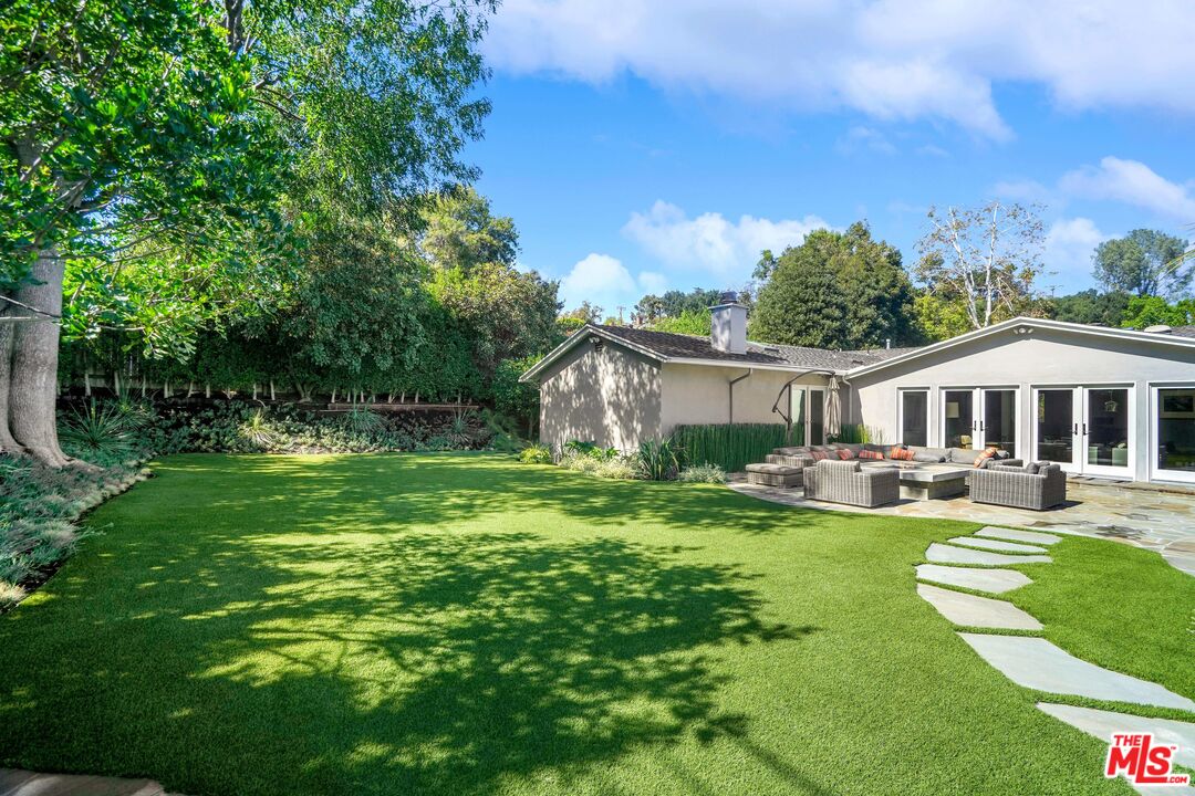 16722 Adlon Road Encino, CA 91436 - Photo 31 of 36 a view of a house with swimming pool and sitting area