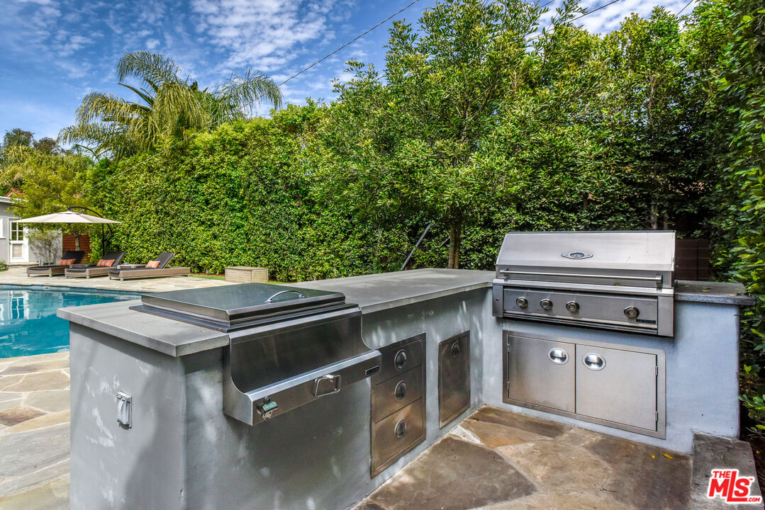 16722 Adlon Road Encino, CA 91436 - Photo 32 of 36 a view of a kitchen with a stove